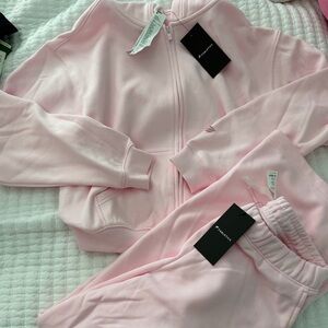 Fabletics warm pink sweat suit NWT
bottoms small regular—- jacket medium
